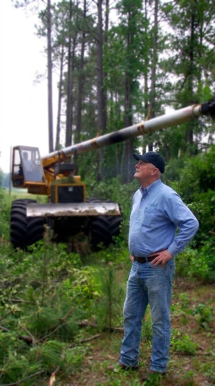 John Olson checking on right-of-way clearing equipment at his commercial tree company
